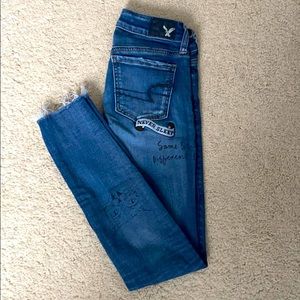 American Eagle jeans with cute patches and doodles